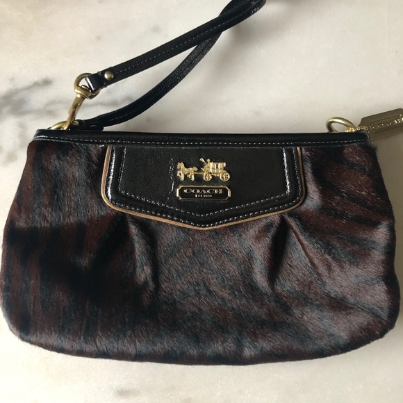 Coach Handbags - Large Coach Leopard/Fur Wristlet
Like new cond